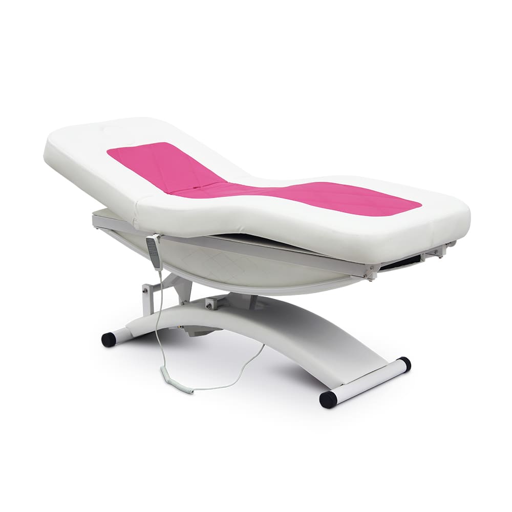 white and pink electric massage table